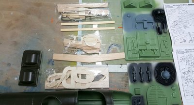 Wheels Packet, Nacelles Packet, and Wing Fuselage Packet of wood  parts. <br />Plastic parts are interior bulkheads and deck parts