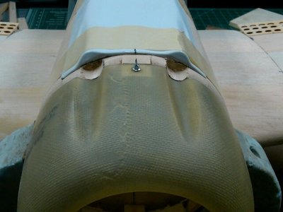 Top of cowl with gun recesses sanded out with the dremel. I will be using low profile screws on the finished plane.
