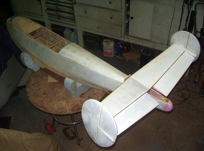 There is a plywood forward bulkhead and pink foam saddleit is sitting on.It will be secured with a lineup dowel and nylon screws for mounting.