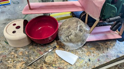 After curing for a day or more. Cut a small tapered blade from a Clorox bleach bottle and wiggle it in between the mold and the new cowling. Go all around the bowl to a short depth and keep doing it until you get deep into the bottom continuing to go slowly around. It will pop loose.