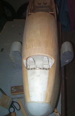 The basic shape of the moved cockpit area 1inch forward. seats are just placed in there. the acces hatch was sanded to shape.