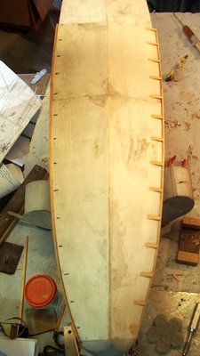 Meaured off every 2 inches and glued in wedge shapes and a long 1/8&quot; square balsa strake for the chine edges.